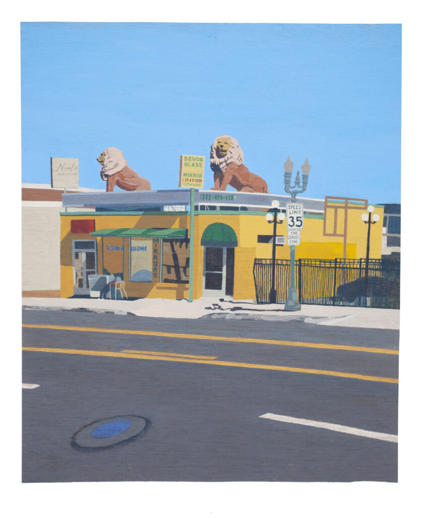 yellow building with lions on top